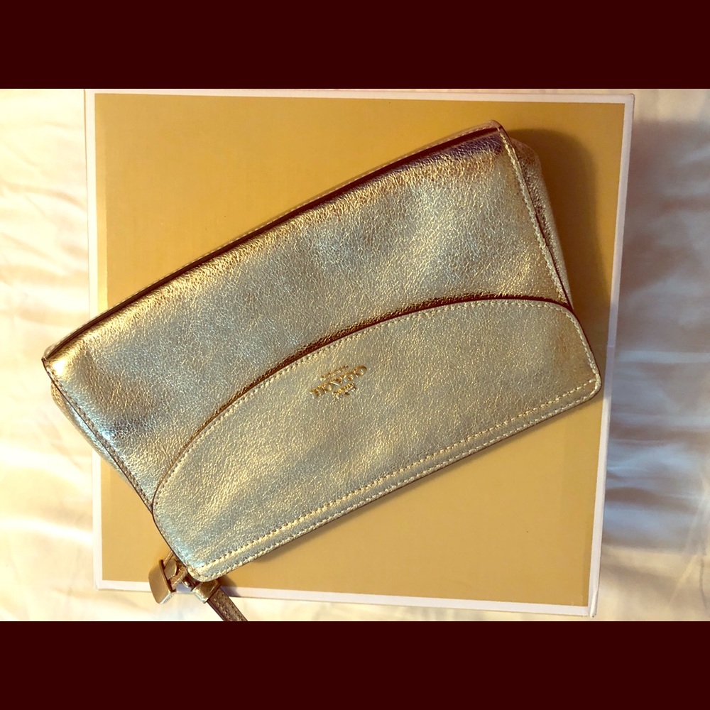 Coach  gold clutch.   New with tags